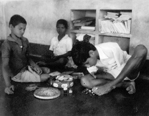 Children using hands and feet to do things.