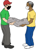 Two masked workers together carrying a large, heavy sack.